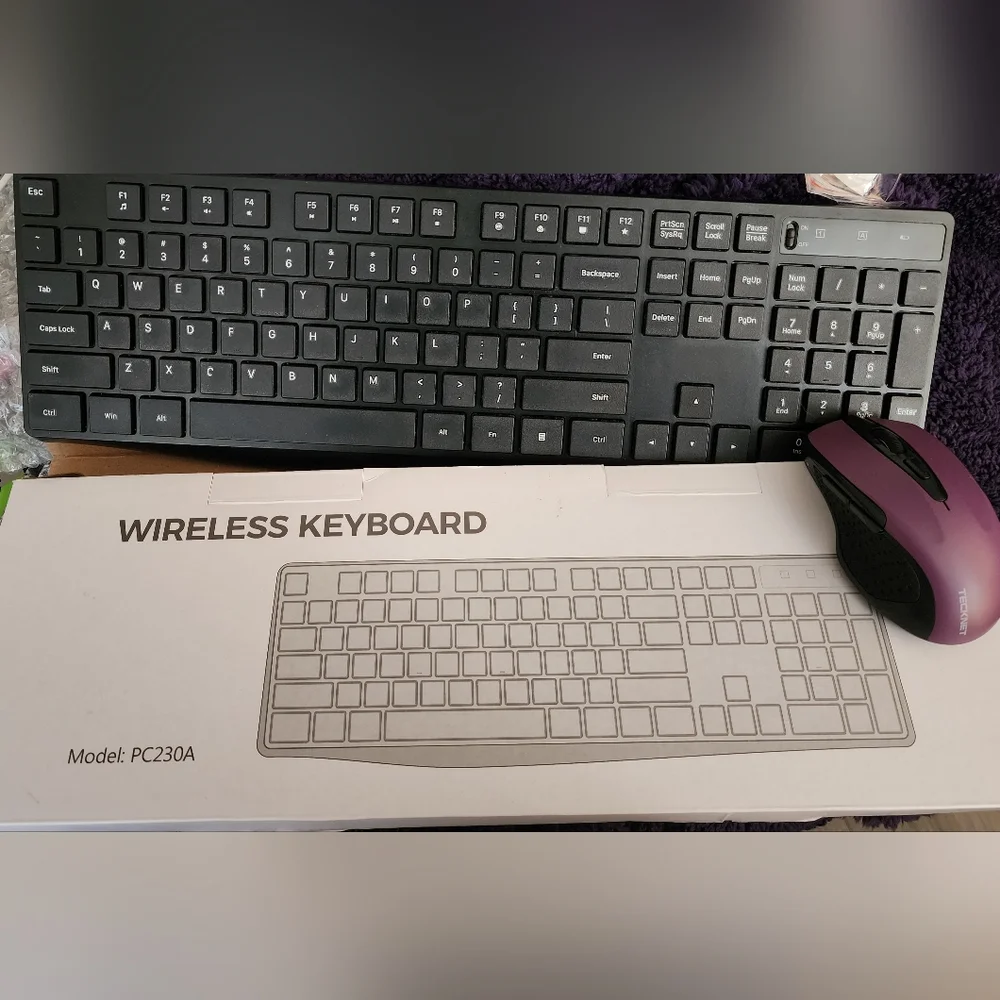 Wireless Keyboard Is Black andTECK NET Mouse Is Black and Purple U Get Both